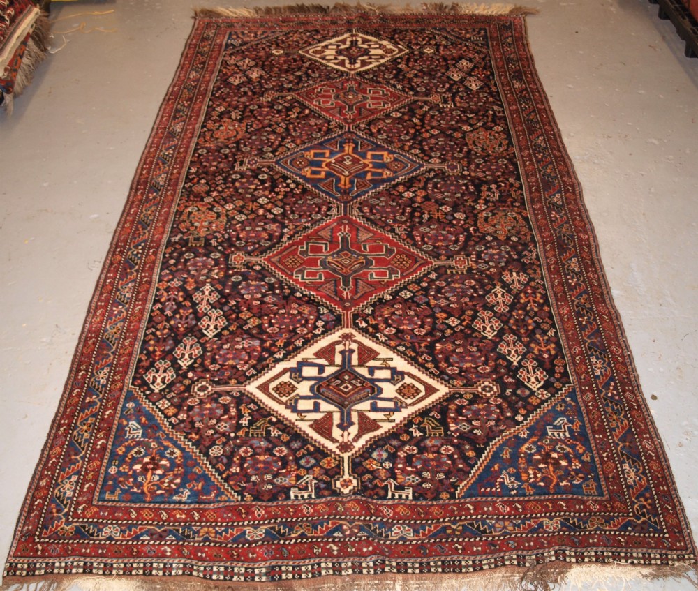 ANTIQUE QASHQAI RUG, TRIBAL DESIGN WITH GREAT COLOUR, LATE 19TH CENTURY.