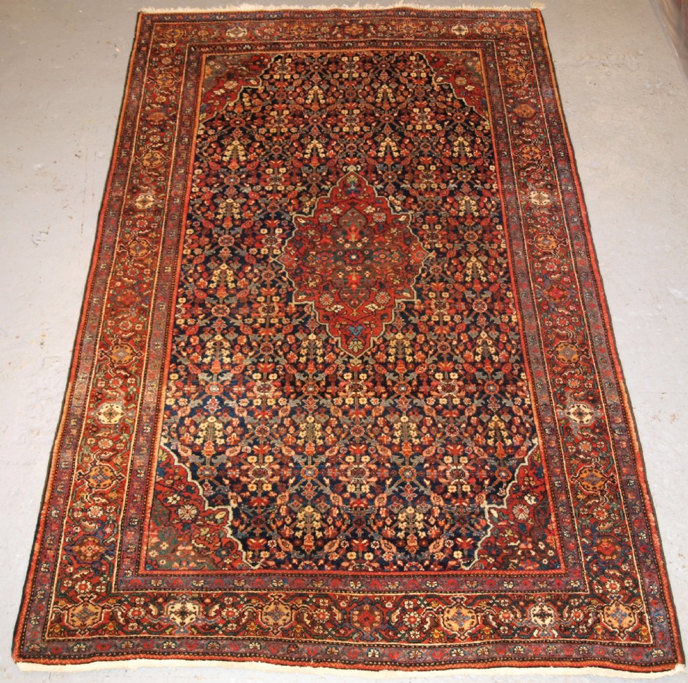 ANTIQUE PERSIAN FARAGHAN RUG WITH SHRUB DESIGN, FULL PILE WITH GREAT COLOUR. CIRCA 1900.