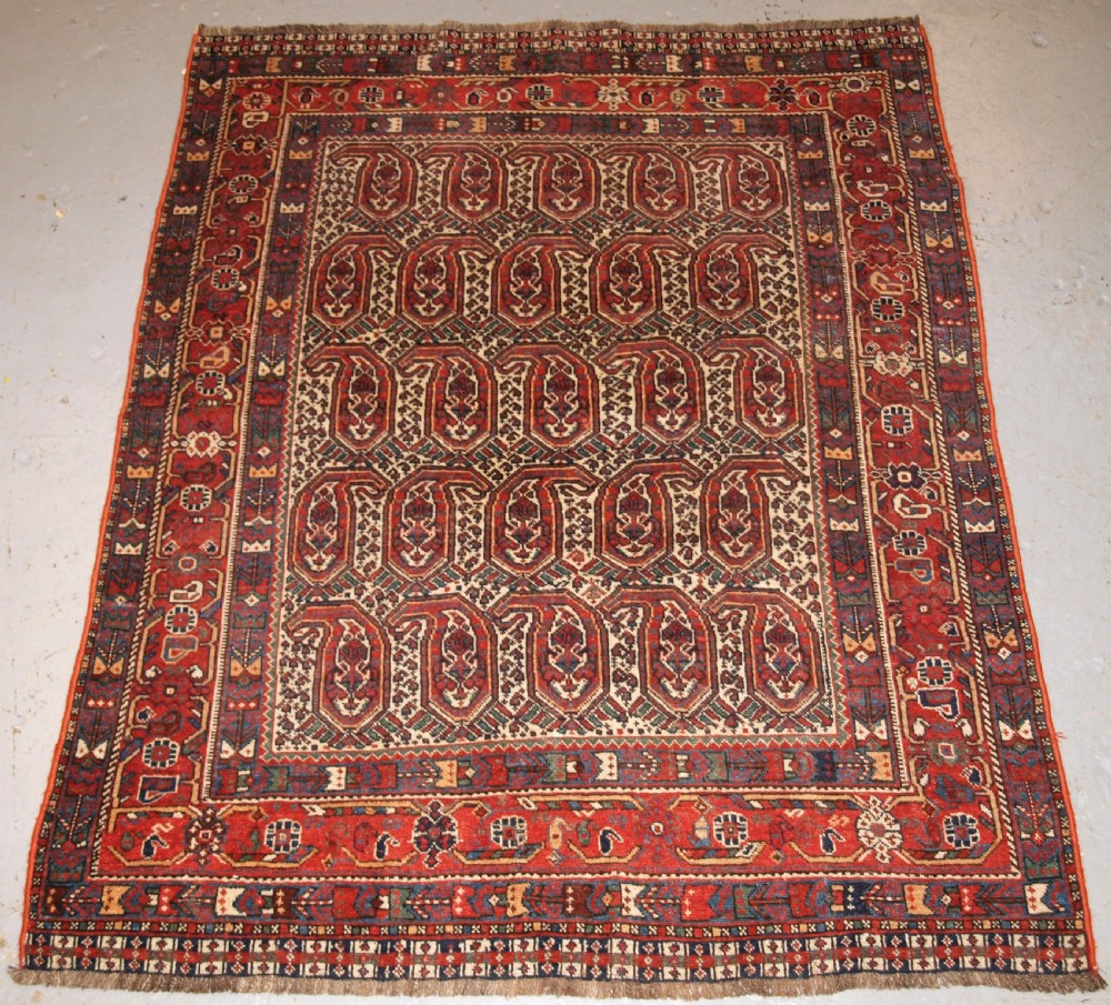 ANTIQUE KHAMSEH RUG WITH REPEAT BOTEH DESIGN, CIRCA 1900.