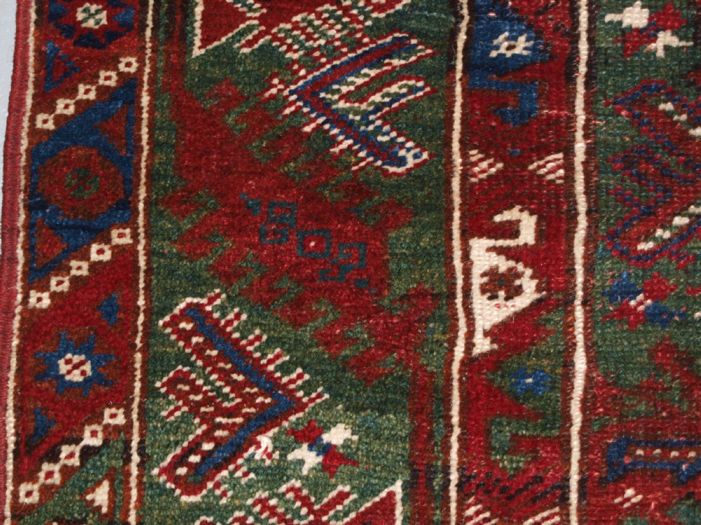 OLD TURKISH DOSEMEALTI VILLAGE RUG WITH UNUSUAL GREEN GROUND, CIRCA 1920. View III