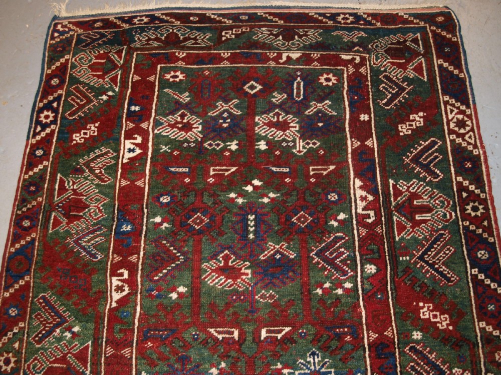 OLD TURKISH DOSEMEALTI VILLAGE RUG WITH UNUSUAL GREEN GROUND, CIRCA 1920. View IV