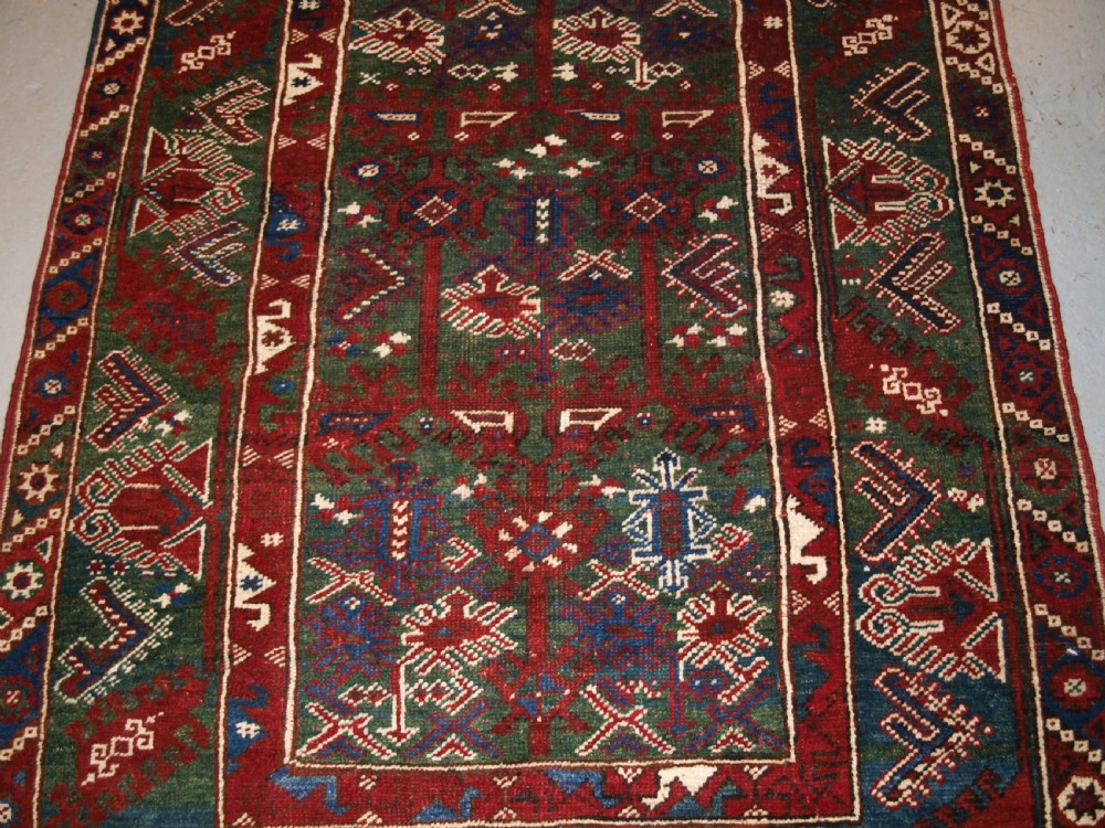 OLD TURKISH DOSEMEALTI VILLAGE RUG WITH UNUSUAL GREEN GROUND, CIRCA 1920. View V