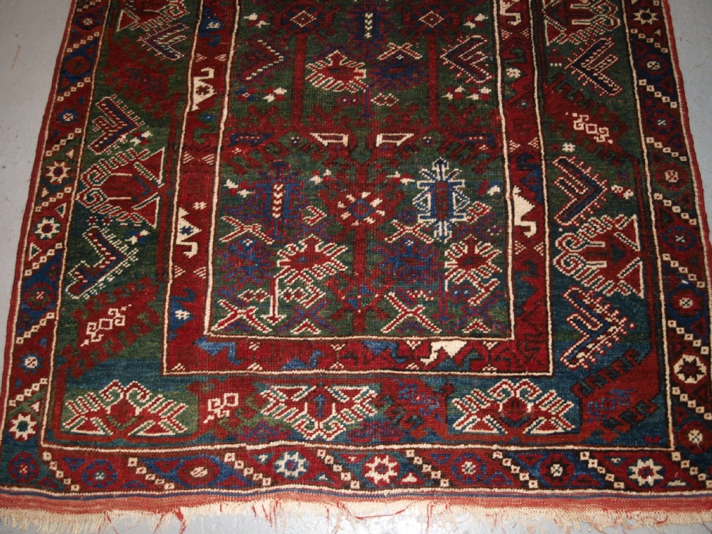 OLD TURKISH DOSEMEALTI VILLAGE RUG WITH UNUSUAL GREEN GROUND, CIRCA 1920. View VI