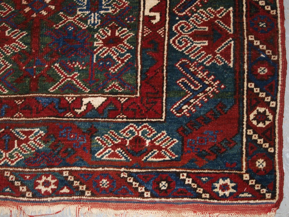OLD TURKISH DOSEMEALTI VILLAGE RUG WITH UNUSUAL GREEN GROUND, CIRCA 1920. View IX