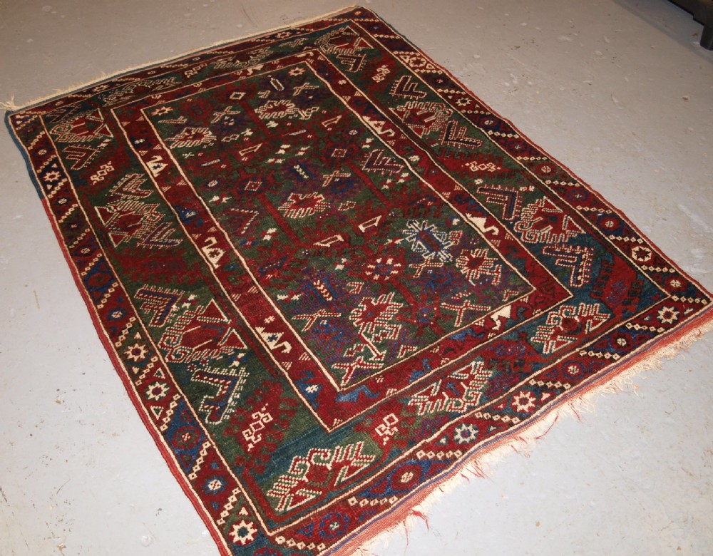 OLD TURKISH DOSEMEALTI VILLAGE RUG WITH UNUSUAL GREEN GROUND, CIRCA 1920. View XII