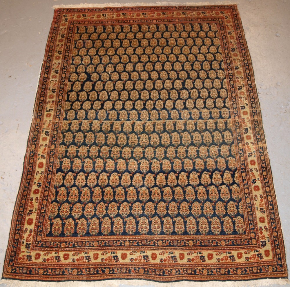 ANTIQUE NORTH WEST PERSIAN SERABEND VILLAGE RUG, BOTEH DESIGN, CIRCA 1900.