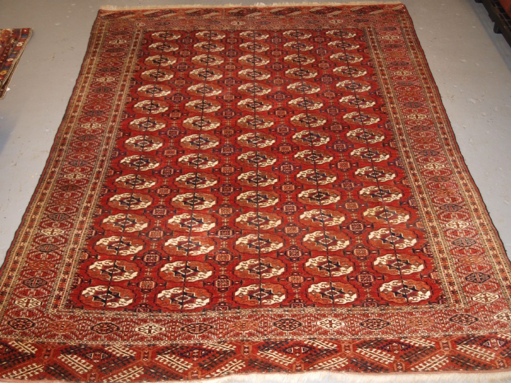 ANTIQUE TEKKE TURKMEN MAIN CARPET, SQUARE SHAPE, GOOD COLOUR, LATE 19TH CENTURY. View II