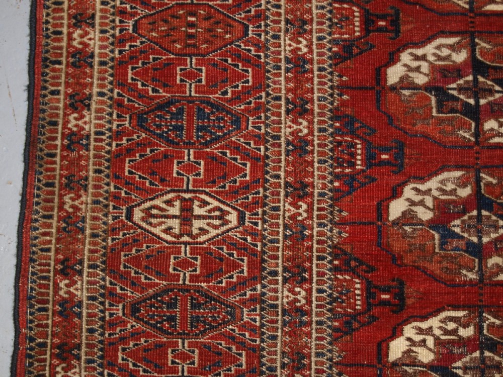 ANTIQUE TEKKE TURKMEN MAIN CARPET, SQUARE SHAPE, GOOD COLOUR, LATE 19TH CENTURY. View IV