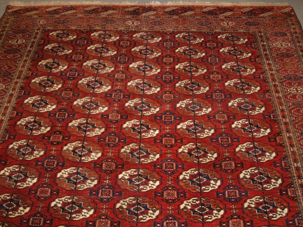 ANTIQUE TEKKE TURKMEN MAIN CARPET, SQUARE SHAPE, GOOD COLOUR, LATE 19TH CENTURY. View V