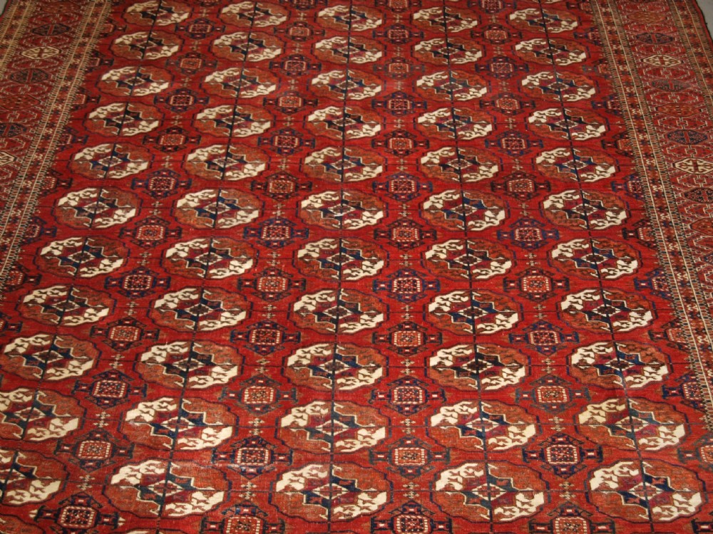 ANTIQUE TEKKE TURKMEN MAIN CARPET, SQUARE SHAPE, GOOD COLOUR, LATE 19TH CENTURY. View VI