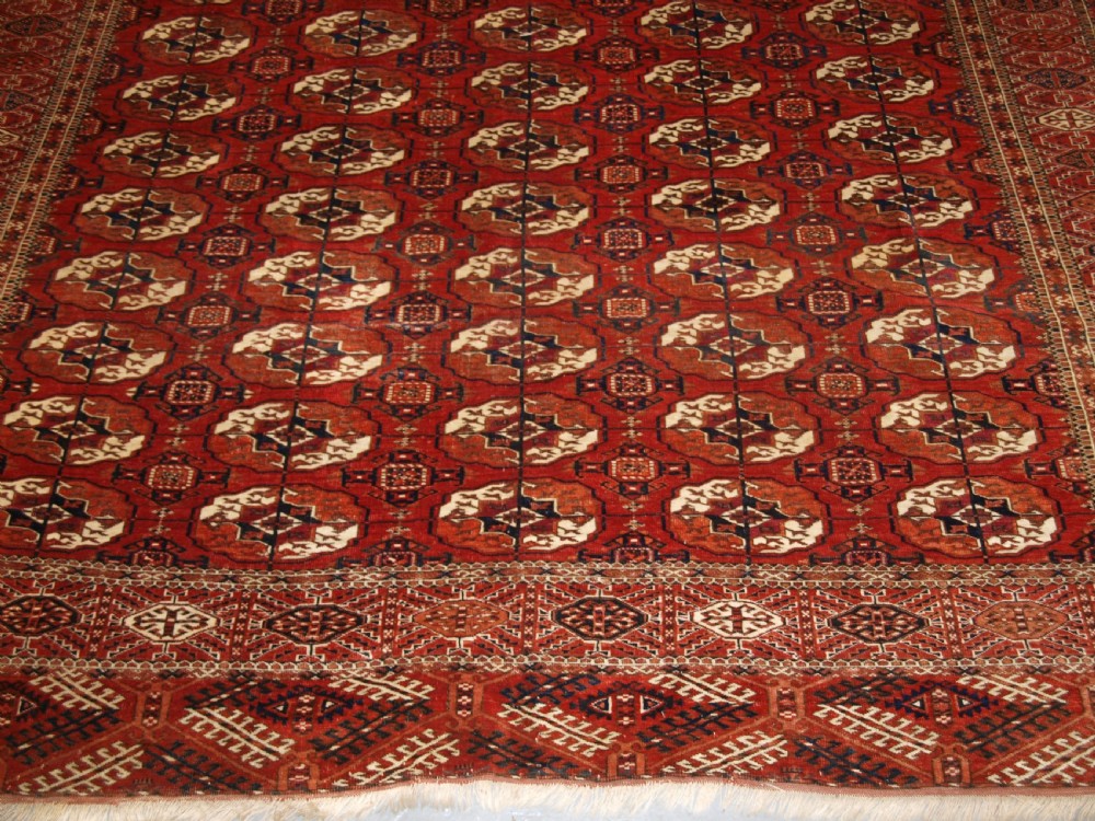 ANTIQUE TEKKE TURKMEN MAIN CARPET, SQUARE SHAPE, GOOD COLOUR, LATE 19TH CENTURY. View VII