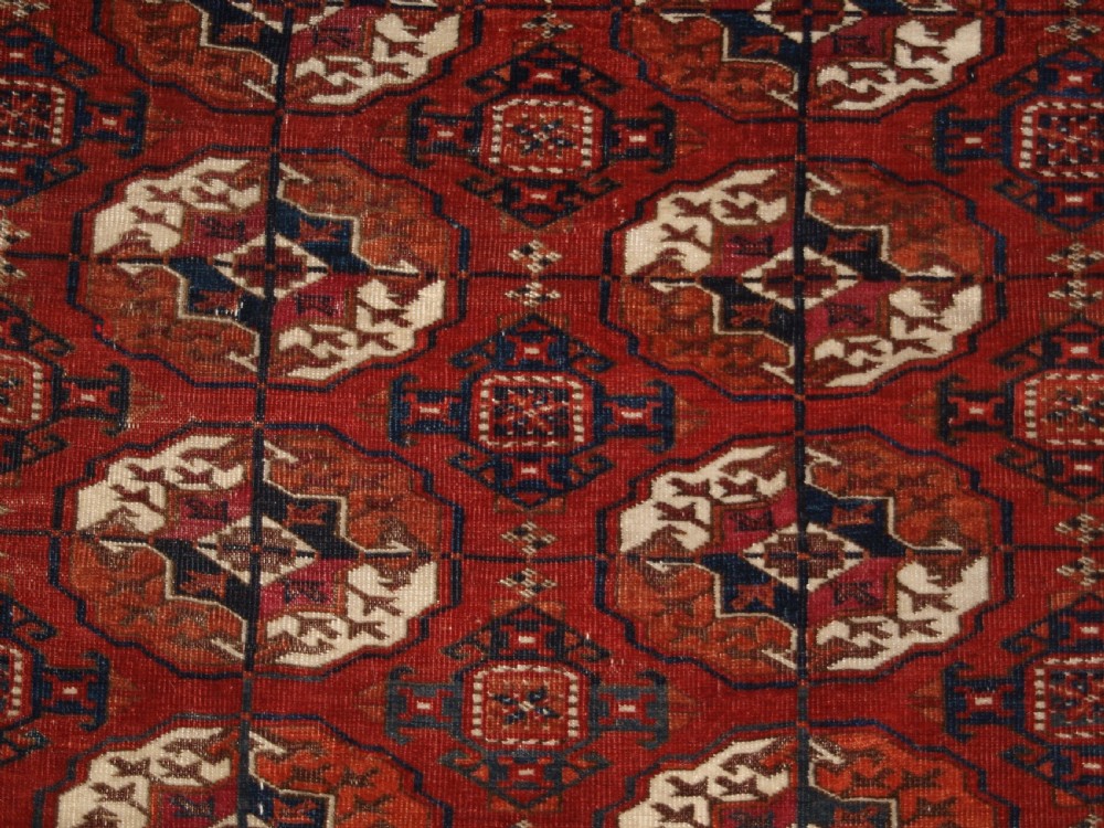 ANTIQUE TEKKE TURKMEN MAIN CARPET, SQUARE SHAPE, GOOD COLOUR, LATE 19TH CENTURY. View VIII