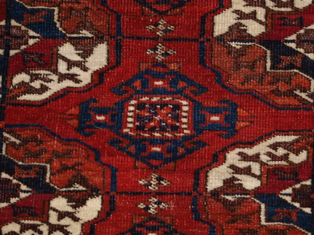 ANTIQUE TEKKE TURKMEN MAIN CARPET, SQUARE SHAPE, GOOD COLOUR, LATE 19TH CENTURY. View IX