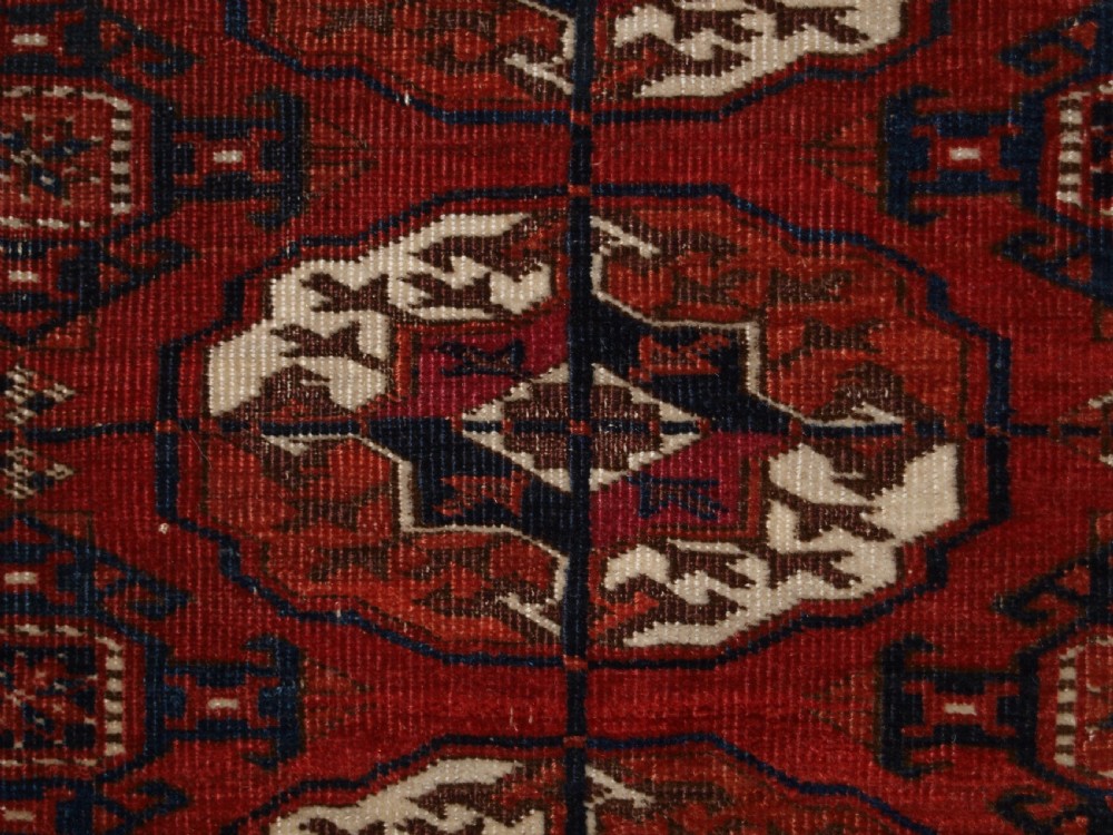 ANTIQUE TEKKE TURKMEN MAIN CARPET, SQUARE SHAPE, GOOD COLOUR, LATE 19TH CENTURY. View XI