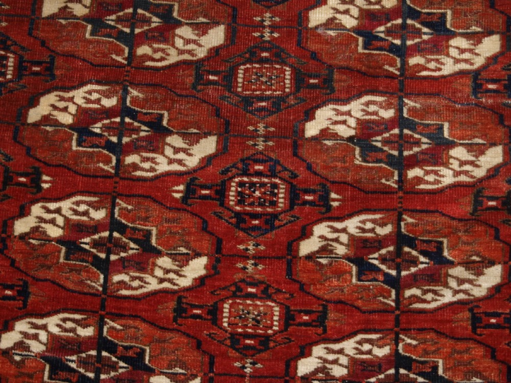 ANTIQUE TEKKE TURKMEN MAIN CARPET, SQUARE SHAPE, GOOD COLOUR, LATE 19TH CENTURY. View XIII