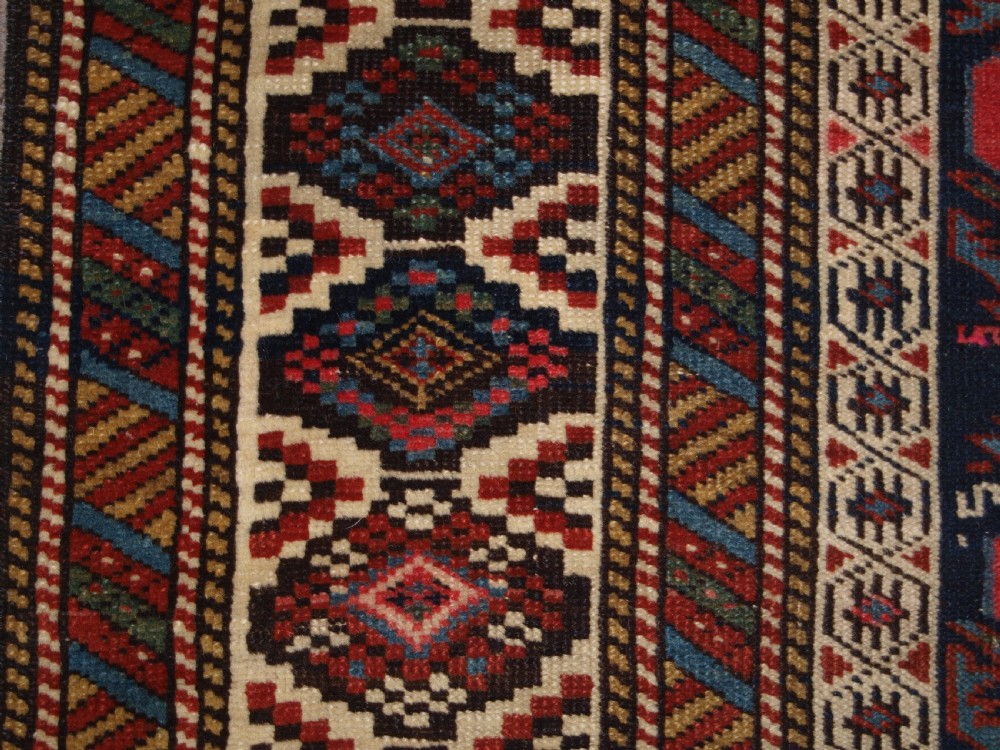ANTIQUE CAUCASIAN SHIRVAN RUG WITH LATTICE DESIGN FILLED WITH TULIPS, LATE 19TH CENTURY. View VIII