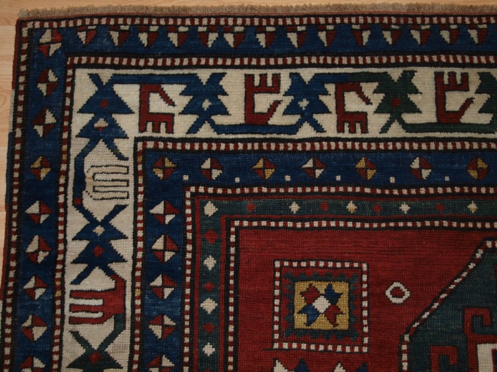 ANTIQUE CAUCASIAN KAZAK RUG WITH MEMLINC GULS, SUPERB BORDER, LATE 19TH CENTURY. View II