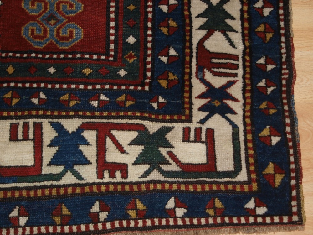 ANTIQUE CAUCASIAN KAZAK RUG WITH MEMLINC GULS, SUPERB BORDER, LATE 19TH CENTURY. View IX