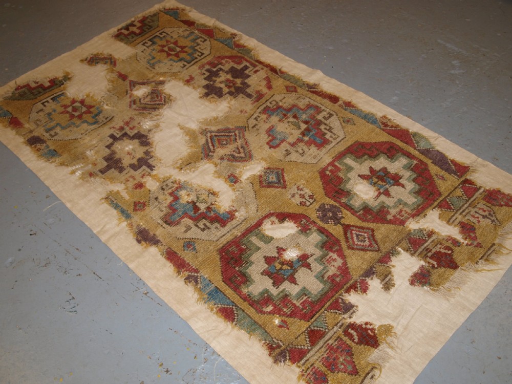 ANTIQUE MOUNTED FRAGMENT OF TURKISH KONYA LONG RUG WITH MEMLINC GULS, 1ST HALF 18TH CENTURY. View II