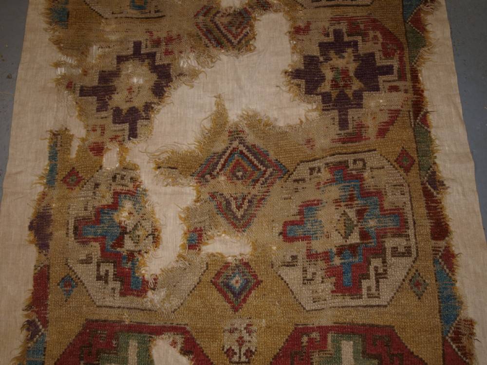 ANTIQUE MOUNTED FRAGMENT OF TURKISH KONYA LONG RUG WITH MEMLINC GULS, 1ST HALF 18TH CENTURY. View IV