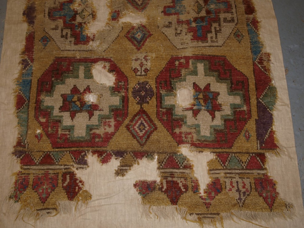 ANTIQUE MOUNTED FRAGMENT OF TURKISH KONYA LONG RUG WITH MEMLINC GULS, 1ST HALF 18TH CENTURY. View V