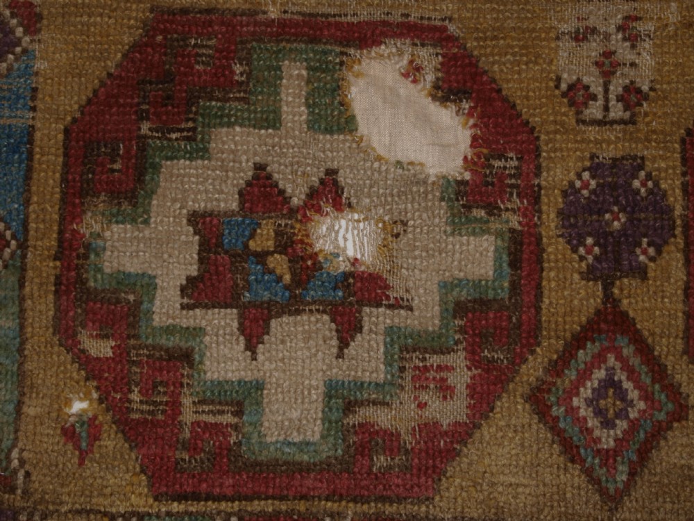 ANTIQUE MOUNTED FRAGMENT OF TURKISH KONYA LONG RUG WITH MEMLINC GULS, 1ST HALF 18TH CENTURY. View X