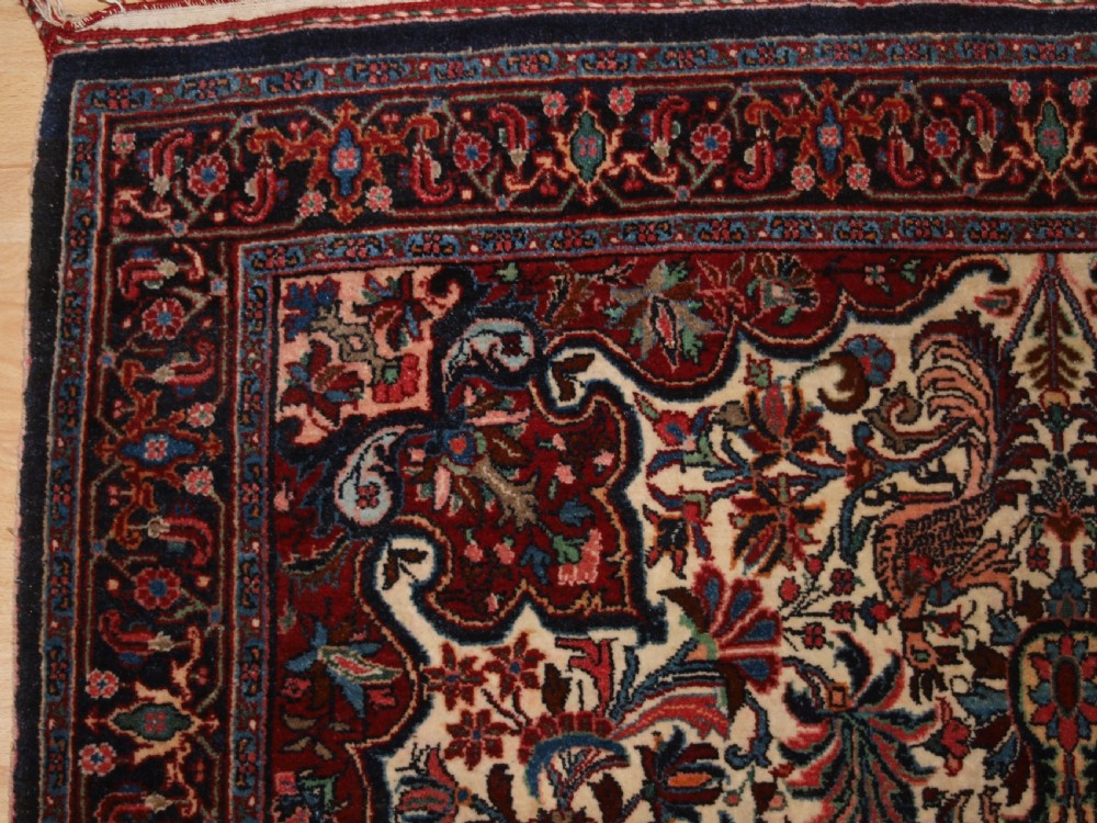 OLD PERSIAN BIJAR RUG, IVORY GROUND WITH FLORAL DESIGN, CIRCA 1920/30. View II