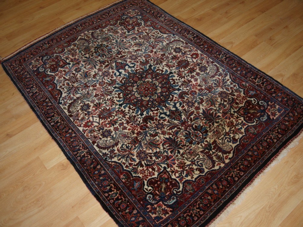 OLD PERSIAN BIJAR RUG, IVORY GROUND WITH FLORAL DESIGN, CIRCA 1920/30. View IX