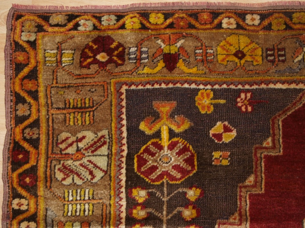 ANTIQUE TURKISH MADEN REGION RUG, DOUBLE MEDALLION, RED GROUND, CIRCA 1900. View II