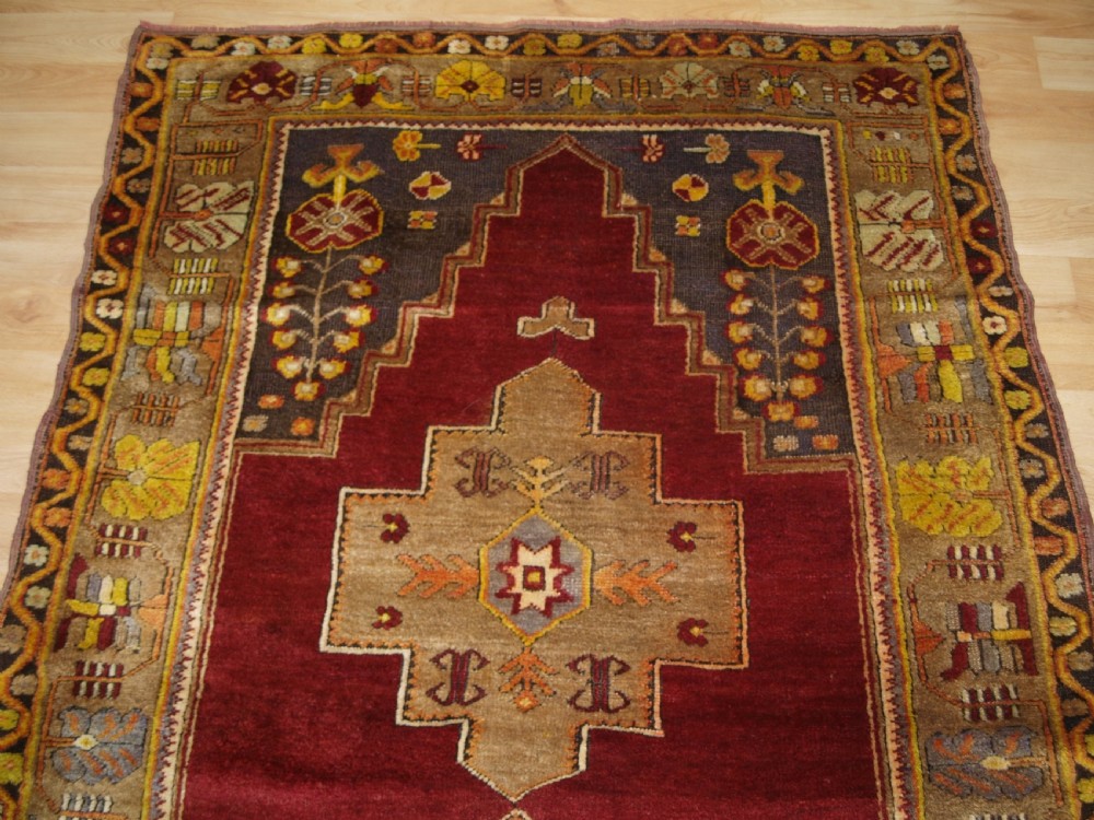 ANTIQUE TURKISH MADEN REGION RUG, DOUBLE MEDALLION, RED GROUND, CIRCA 1900. View IV