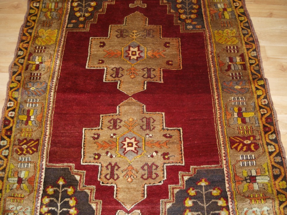 ANTIQUE TURKISH MADEN REGION RUG, DOUBLE MEDALLION, RED GROUND, CIRCA 1900. View V