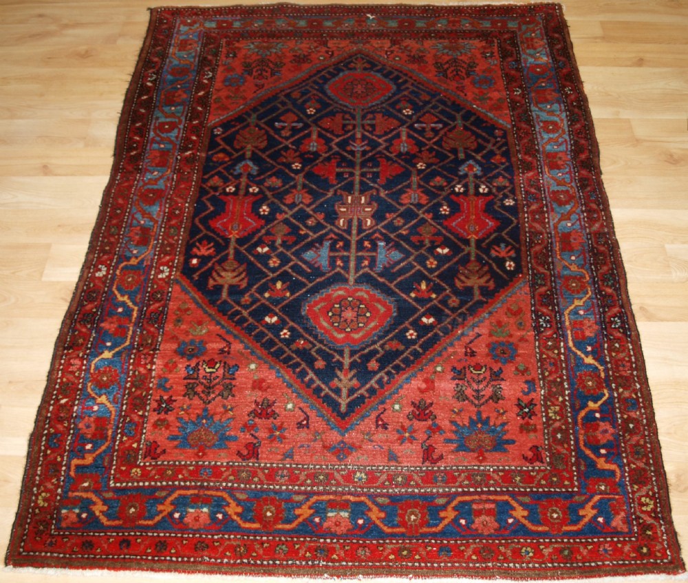 ANTIQUE MALAYER VILLAGE RUG, UNUSUAL DESIGN, CIRCA 1900/20.
