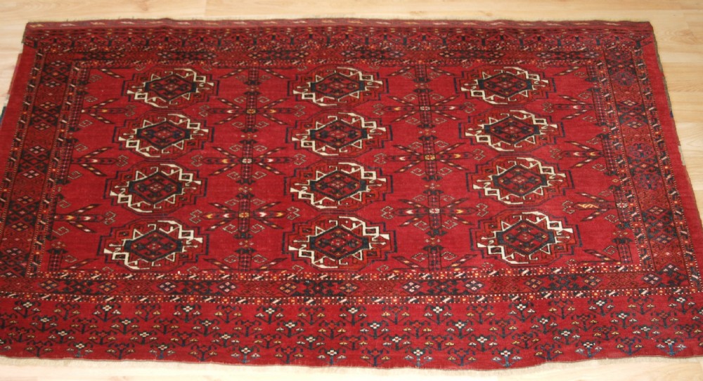 ANTIQUE KIZIL AYAK ERSARI TURKMEN 12 GUL CHUVAL, CIRCA 1900.