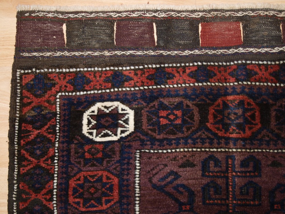ANTIQUE BALUCH SADDLE BAG FACE, STAR IN OCTAGON DESIGN, CIRCA 1900. View II
