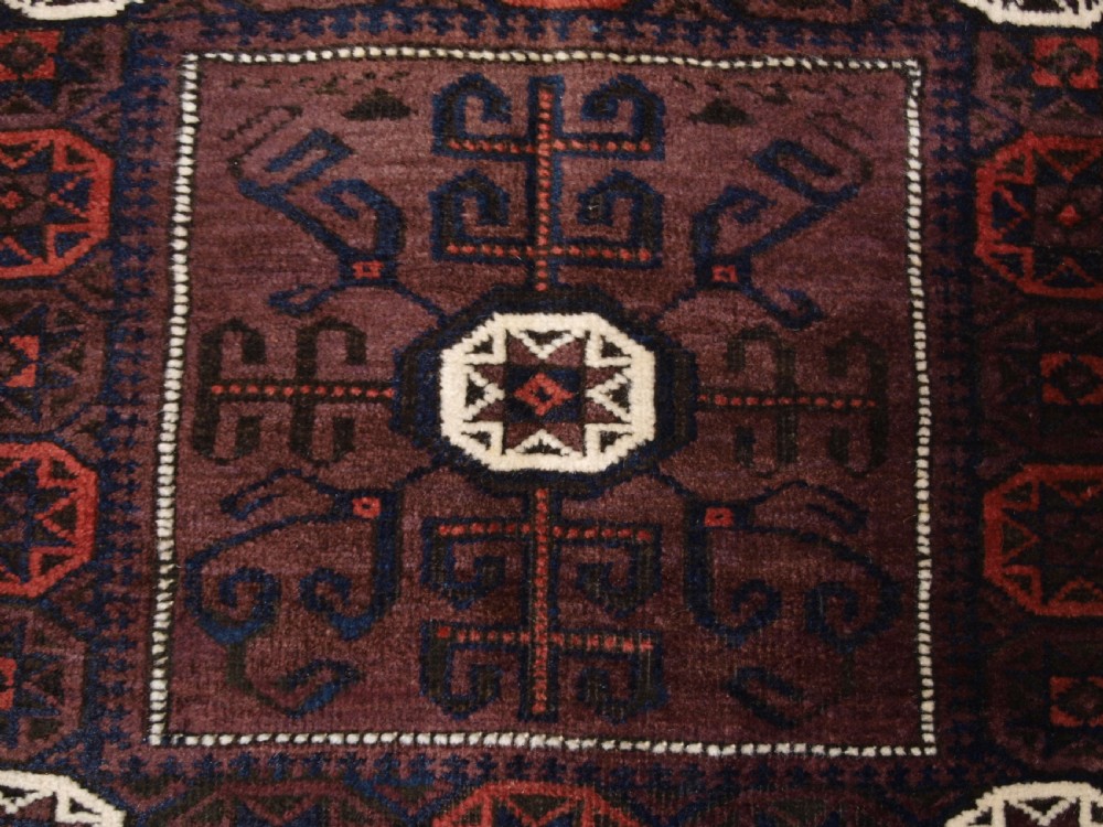 ANTIQUE BALUCH SADDLE BAG FACE, STAR IN OCTAGON DESIGN, CIRCA 1900. View III