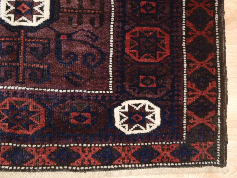 ANTIQUE BALUCH SADDLE BAG FACE, STAR IN OCTAGON DESIGN, CIRCA 1900. View IV