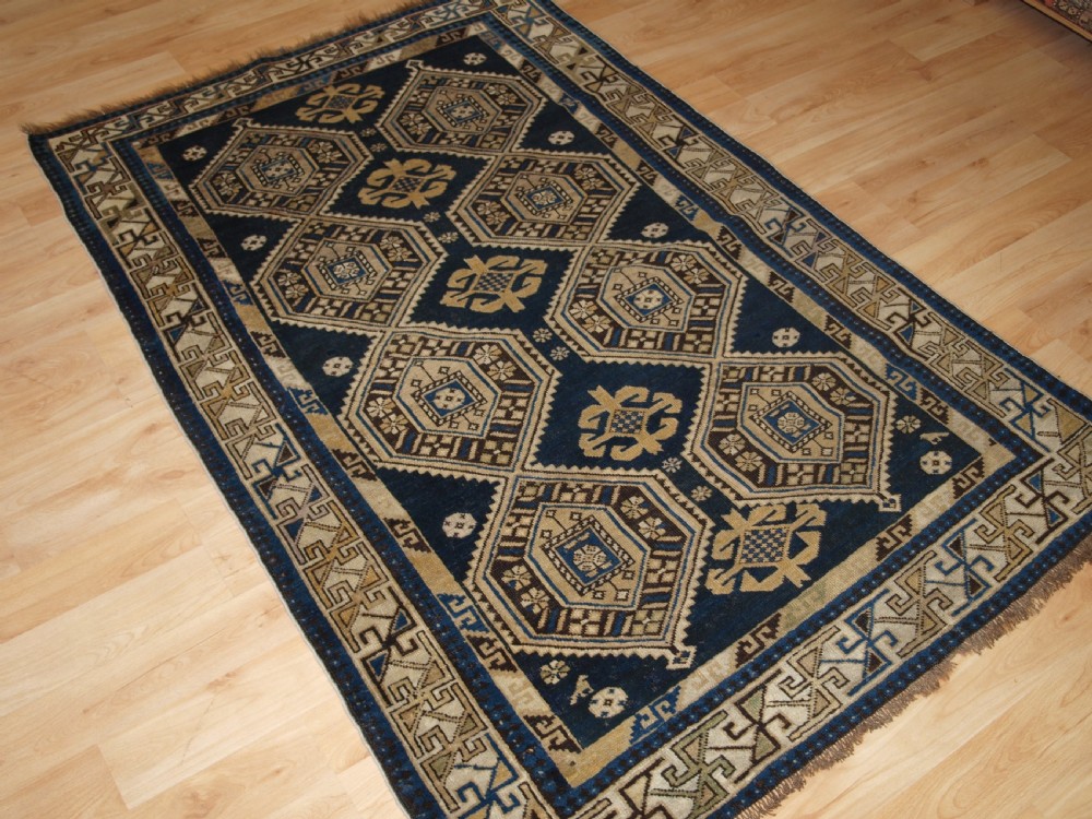 ANTIQUE CAUCASIAN SHIRVAN RUG WITH SOFT FADED COLOURS, CIRCA 1900. View II