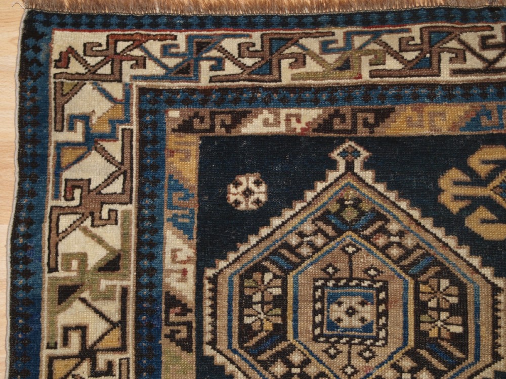 ANTIQUE CAUCASIAN SHIRVAN RUG WITH SOFT FADED COLOURS, CIRCA 1900. View III