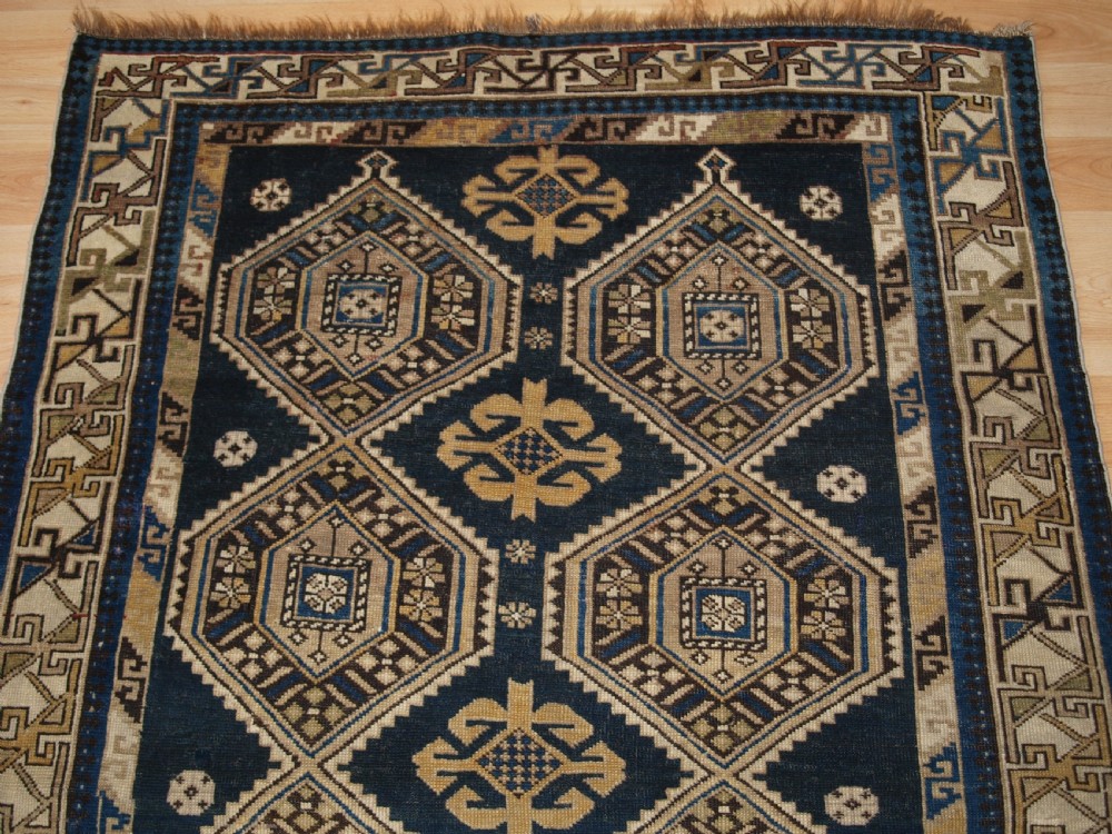 ANTIQUE CAUCASIAN SHIRVAN RUG WITH SOFT FADED COLOURS, CIRCA 1900. View V