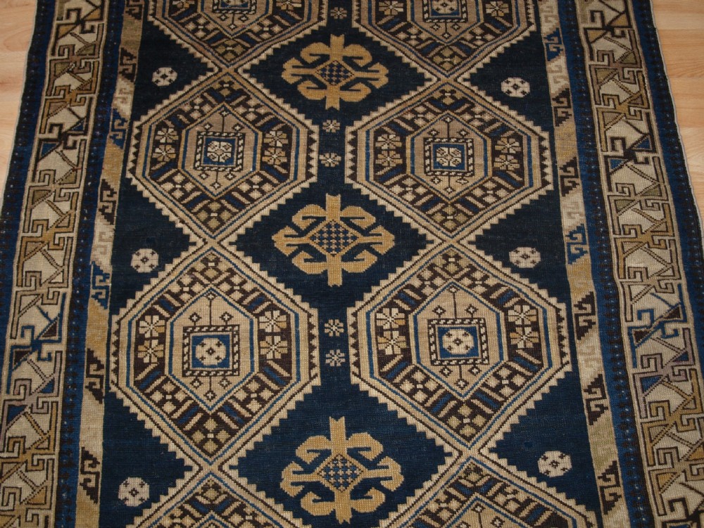 ANTIQUE CAUCASIAN SHIRVAN RUG WITH SOFT FADED COLOURS, CIRCA 1900. View VI