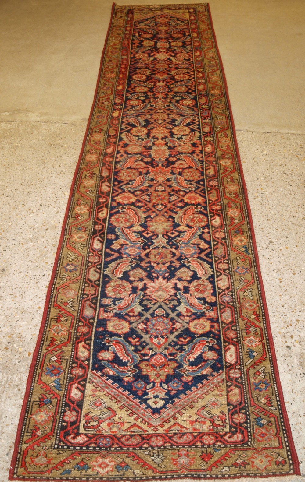ANTIQUE MALAYER RUNNER, SOFT COLOURS, HERATI DESIGN, CIRCA 1900.