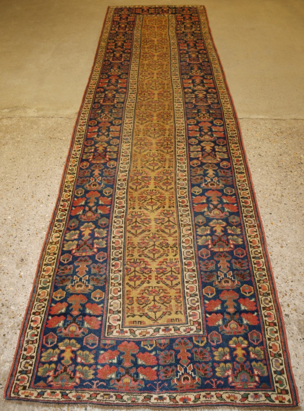 ANTIQUE KURDISH RUNNER, SHRUB DESIGN ON A YELLOW GROUND, CIRCA 1880.