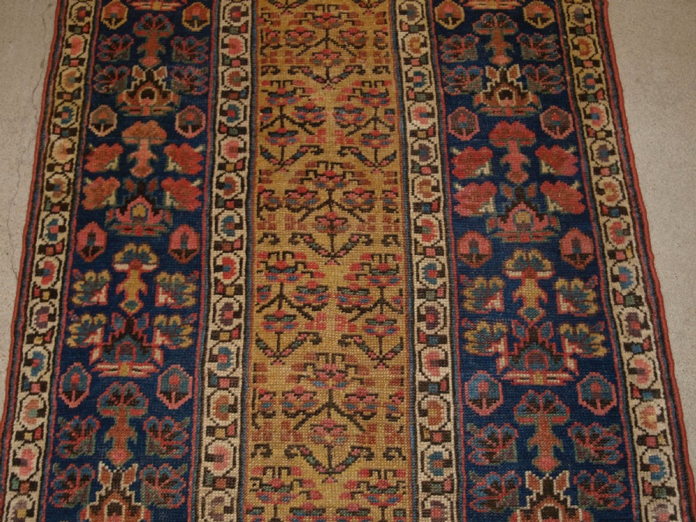 ANTIQUE KURDISH RUNNER, SHRUB DESIGN ON A YELLOW GROUND, CIRCA 1880. View III