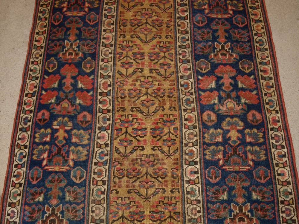 ANTIQUE KURDISH RUNNER, SHRUB DESIGN ON A YELLOW GROUND, CIRCA 1880. View IV