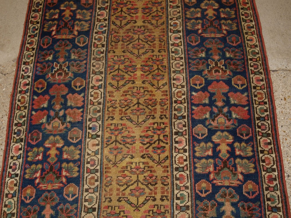 ANTIQUE KURDISH RUNNER, SHRUB DESIGN ON A YELLOW GROUND, CIRCA 1880. View V