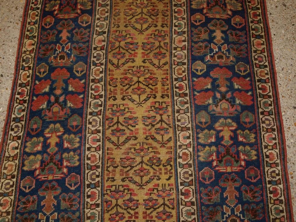 ANTIQUE KURDISH RUNNER, SHRUB DESIGN ON A YELLOW GROUND, CIRCA 1880. View VI