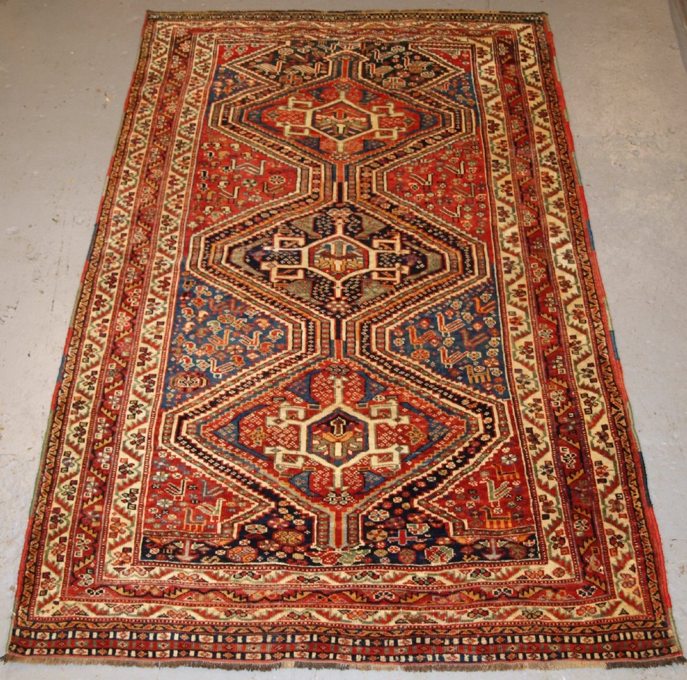 ANTIQUE TRIBAL QASHQAI RUG, TRIPLE MEDALLION WITH SUPERB COLOUR, LATE 19TH CENTURY.