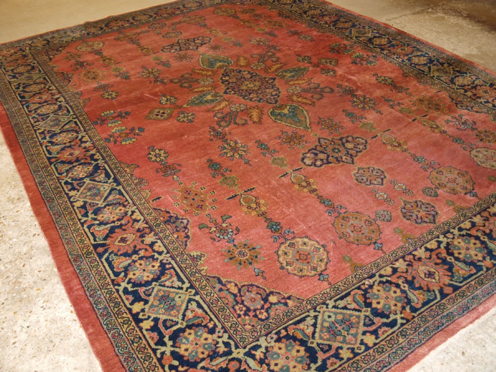 ANTIQUE PERSIAN ZIEGLER MAHAL, ROSE CORAL GROUND, SMALL MEDALLION DESIGN, LATE 19TH CENTURY.