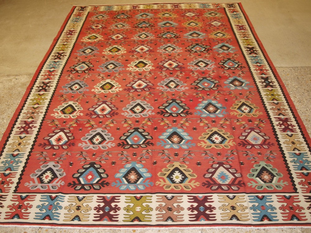 OLD SHARKOY KILIM WITH SOFT COLOUR, TRADITIONAL REPEAT DESIGN, CIRCA 1920.