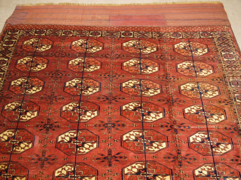 ANTIQUE TEKKE TURKMEN MAIN CARPET WITH RARE OCTAGONAL GULS, MID 19TH CENTURY. View IV